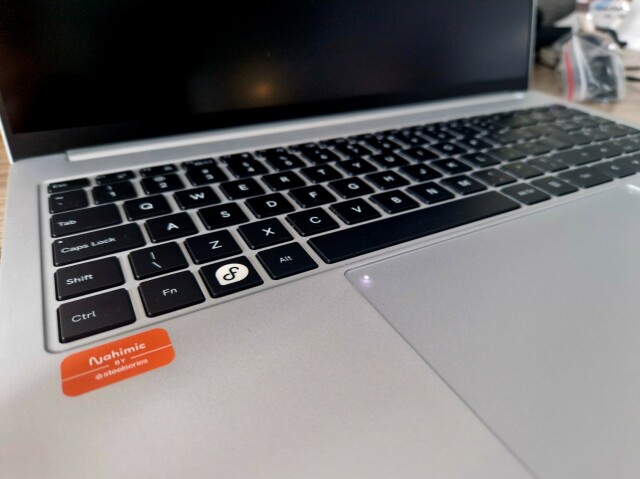 Slimbook keyboard with Fedora logo.