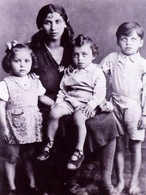 A photo of a Roma family - mother with three children. 