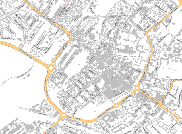 A map of Canterbury, Kent, UK.
It shows grey blocks for buildings. A few main roads are coloured yellow but most are coloured white. Some roads have names.
Trivia just for those who read alt text, this map has the location I met my wife