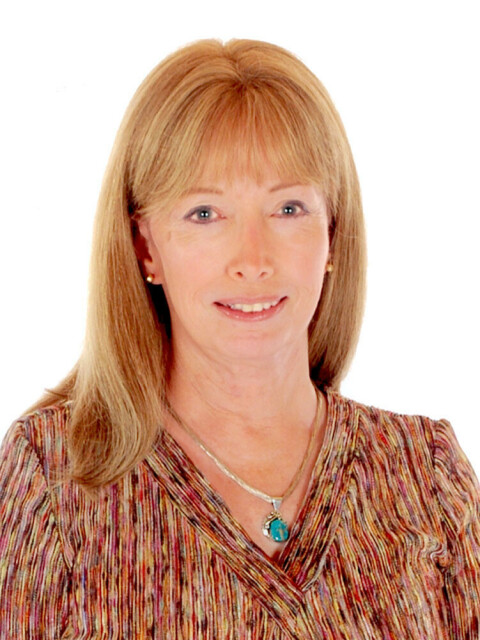 Headshot of a white woman with blonde hair