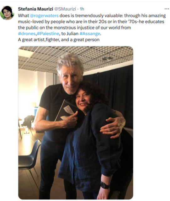 Roger Waters embraces Stefania Maurizi holding "Secret Power", his book tha she donated him. 
