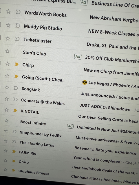 Gmail's web interface showing THREE ads in the middle of a user's email list. (in this screenshot, the ads are from Boost Infinite, Sam's Club, and others)