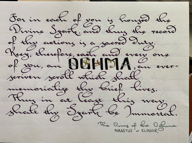 Handwritten text "For in each of you is housed the Divine Spark, and thus the record of thy actions is a sacred duty. Keep, therefore, each and every one of you, an OGHMA, an ever-scriven scroll which shall memorialize thy brief lives. Thus in at least this way shalt thy Spark be Immortal." Below text, citation "The Onus of the Oghma - Phrastus of Elinhir."
Relaxed gothic cursive text in dark purple ink with 1.5 mm Pilot Parallel pen. "Oghma" is written in 0-degree angle block capitals, black ink with 3.8-mm Pilot Parallel pen. The Elder Scrolls magical alphabet letters for "Oghma" are written over the capitals in silver, gold, and copper metallic Sharpie ink. White sketchbook paper. Pencil guidelines and margins faintly visible.