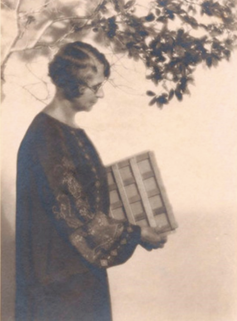 A black and white photo of Ynes Mexia with her plant dryer under a tree. Source: University of California Berkley