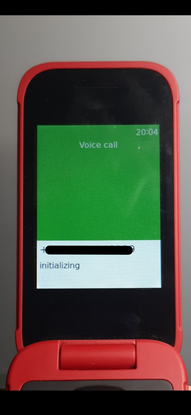 A screen titled "voice call" displayed on a Nokia 2780 Flip, with a phone number (censored) and "initializing" written near the bottom.