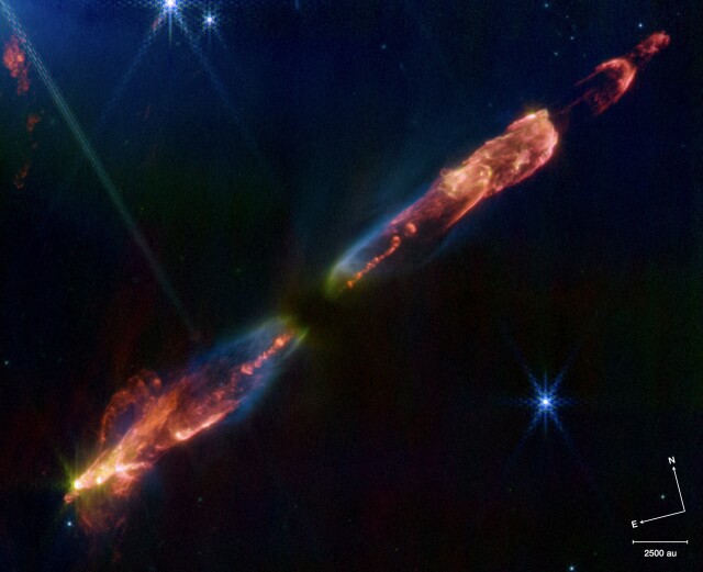 A JWST image of the protostellar outflow HH211 in Perseus, made from a combination of images taken in the F335M, F460M, & F470N filters as blue, gree, & red, respectively. The jet is dominated by emission from molecular hydrogen in all three filters, with dust scattering seen in blue & green, and carbon monoxide as yellow-green in bright knots in the flow.
