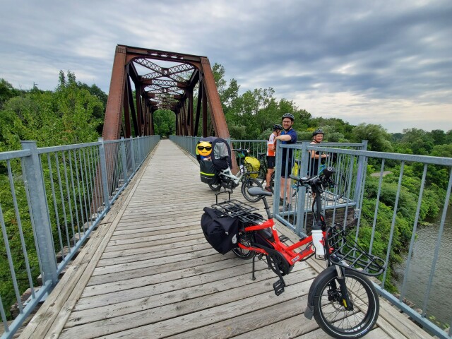 My parents, husband, and toddler with bikes on a rail bridge in Waterford