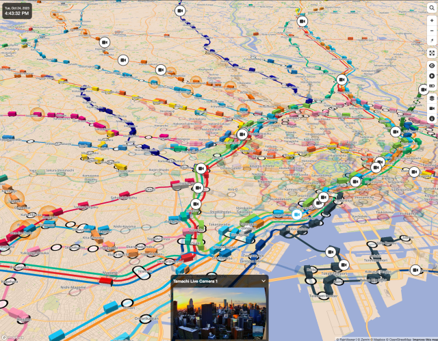 A map of tokyo with public transport lines, little cubes to represent the transports and some live feed from one of the live camera