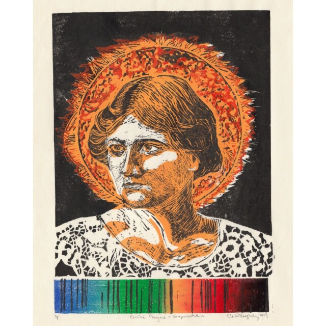 My linocut portrait of Cecilia Payne-Gaposchkin in a lace collar in front of the sun in oranges and black against the blackness of space. At the bottom of the print is the solar absorption spectrum (a rainbow style gradient of indigo at left through to red and black at the right with specific discrete thin black vertical lines at various places).