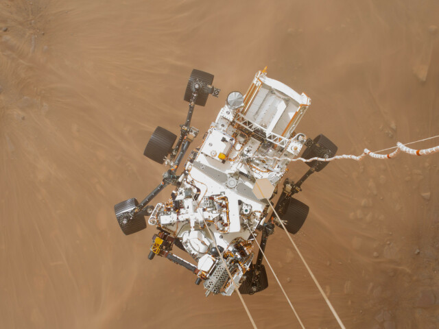 Picture looking down on the Perseverance rover, captured by the Descent Stage Downlook Camera during the Landing in 2021. 