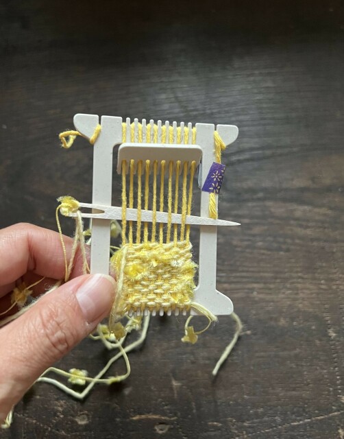 Start weaving with yellow yarn.
