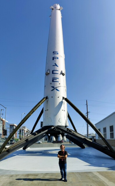 Me in front of the first Falcon 9 booster that landed (without exploding).