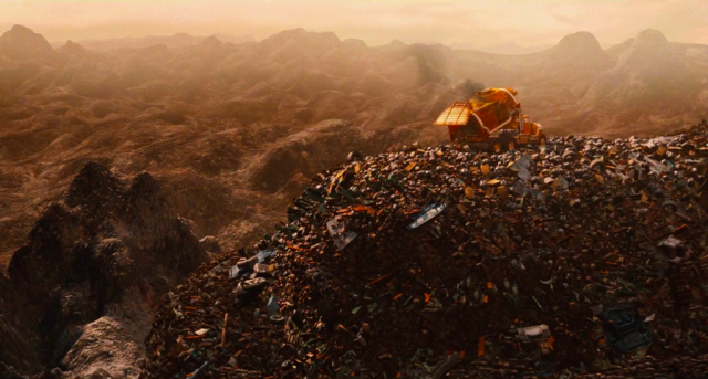 A giant landscape with mountains completely made of garbage. A bulldozer sits on top of it, for scale.