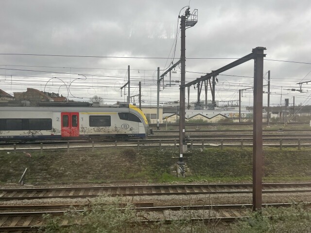 Another train on the track while entering Brussels 