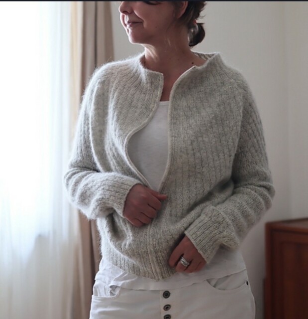 Grey cardigan with zipper shown worn