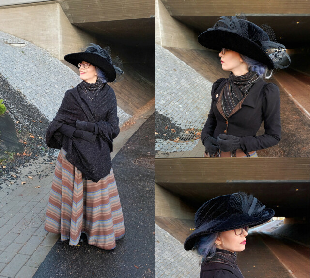 Three photos in a grid, of Sini wearing historically inspired clothing of an indeterminate Victorian or Edwardian style. She is wearing an enormous black velvet hat with a very very wide partially upturned brim. That bit is filled with a jaunty nest of dotted veiling and artistically curling bits of sheer black crinoline tube, which resemble the shape of cocque feathers you'd often see in vintage and historical hats. She is also wearing a closely fitting little black jacket with decorative brown lapels and a puffy sleeve head, a floor length skirt with brown and blue stripes in a chevron pattern, and a very large black shawl and light grey purple wig in a bun. The different views of the hat provided reveal the other side of it to have a fun spiral pattern to the application of the velvet, cleverly wrapped around the huge crown. The velvet has nice bits of deep black and shiny gray according to the grain of the fabric.