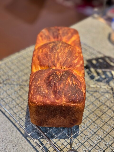 The top of the loaf, showing the obvious croissant like nature of the bread. 