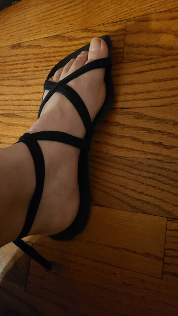 A foot wearing a makeshift sandal with crisscrossing straps.